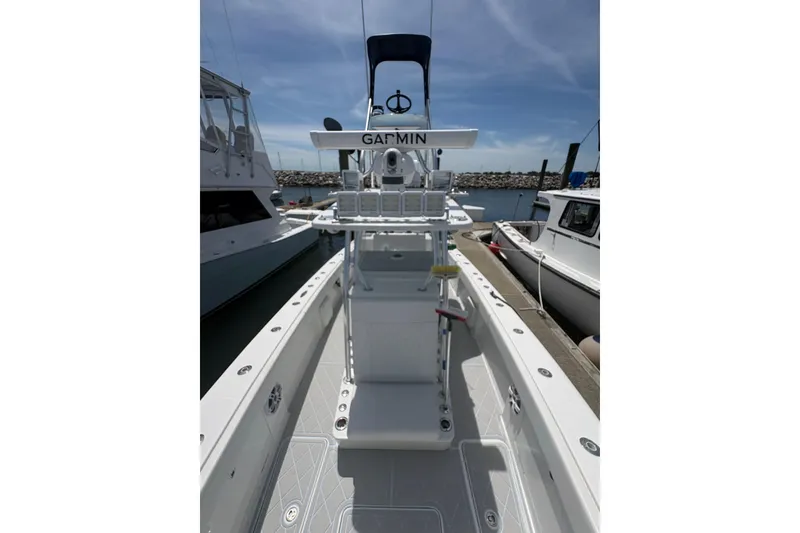 Slide: The Image of 2019 Concept 392 ProFish boat docked, featuring Garmin navigation equipment. - 49