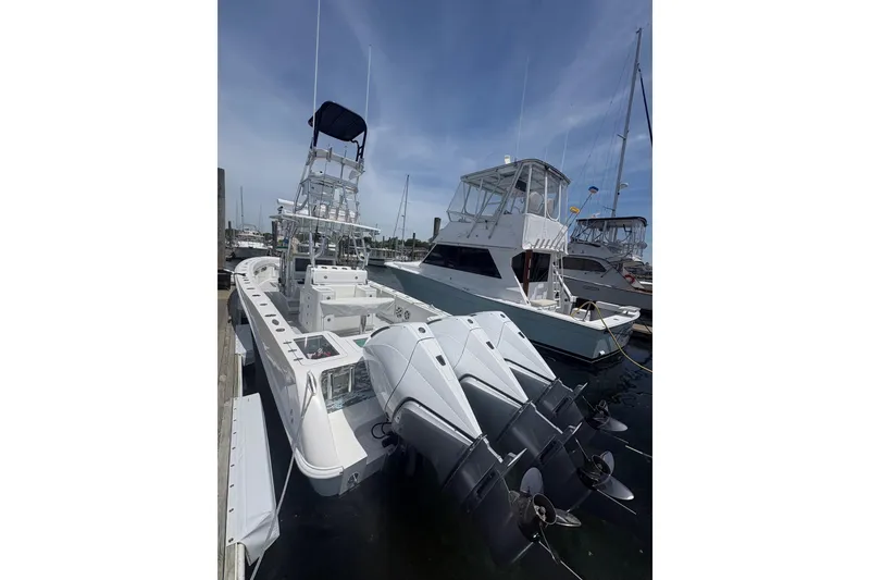 Slide: The Image of 2019 Concept 392 ProFish boat docked with multiple outboard engines. - 5