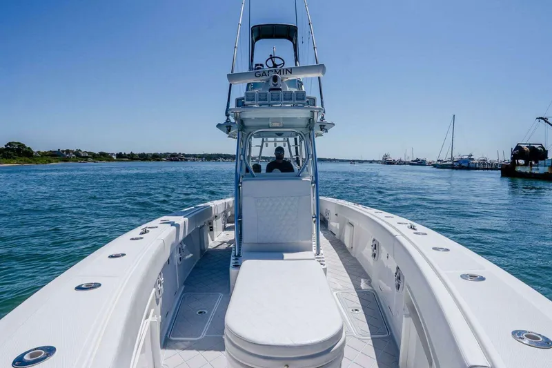 Slide: The Image of 2019 Concept 392 ProFish boat cruising on a sunny day, showcasing sleek design and open water. - 52
