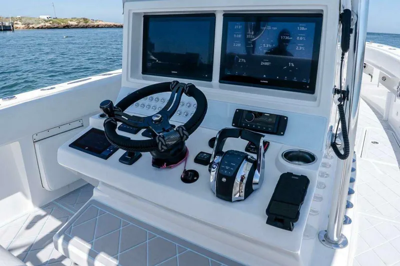 Slide: The Image of Helm of 2019 Concept 392 ProFish boat with advanced navigation displays and controls. - 54