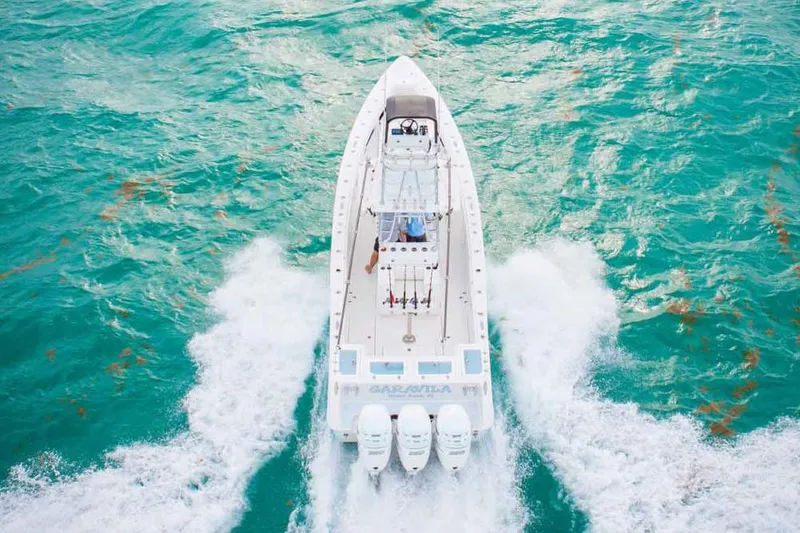 Slide: The Image of Manufacturer Provided Image: 2019 Concept 392 ProFish boat cruising on turquoise waters. - 56