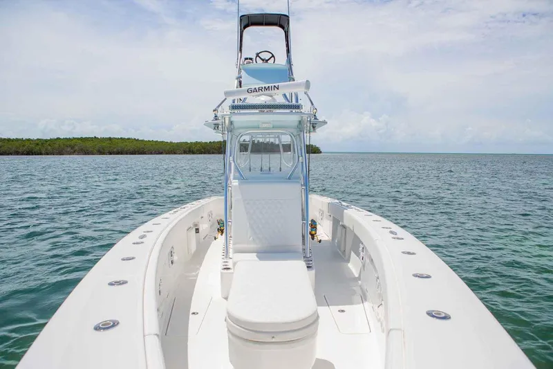 Slide: The Image of Manufacturer Provided Image: 2019 Concept 392 ProFish boat on calm water with clear sky. - 6
