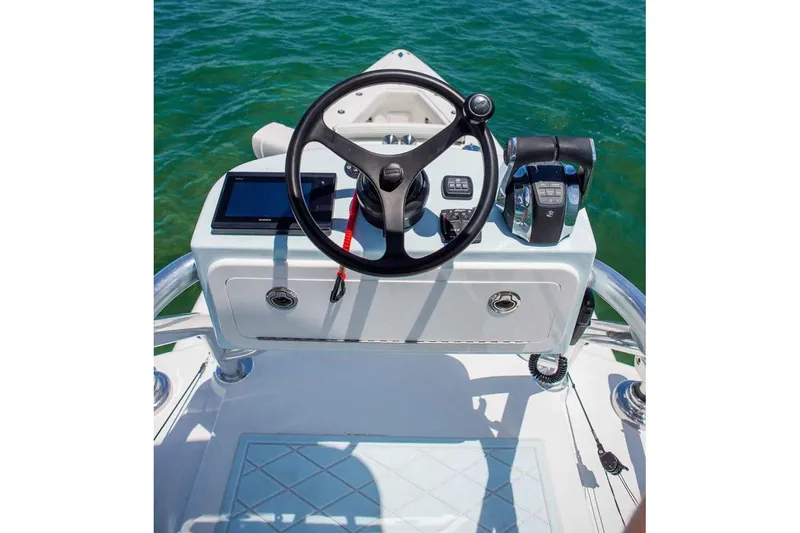 Slide: The Image of Manufacturer Provided Image: 2019 Concept 392 ProFish boat helm with steering wheel and controls on open water. - 7