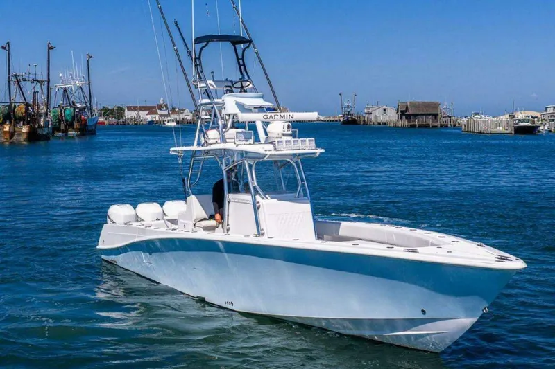 The Image of 2019 Concept 392 ProFish boat on calm water near a harbor. - 0
