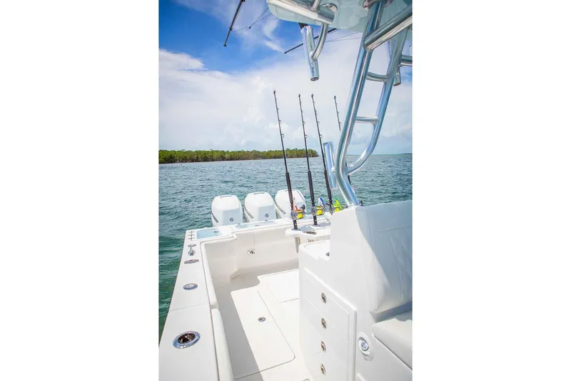 Slide: The Image of Manufacturer Provided Image: 2019 Concept 392 ProFish boat with fishing rods on a sunny day. - 9