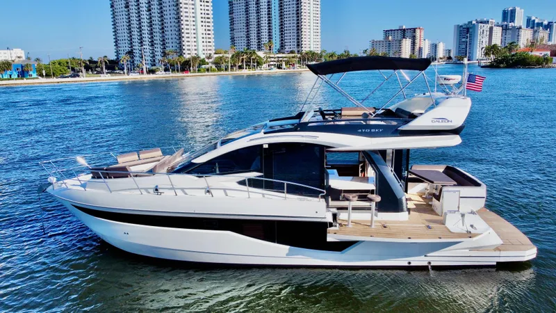 Slide: The Image of 2022 Galeon 470 Sky yacht cruising near city waterfront. - 1