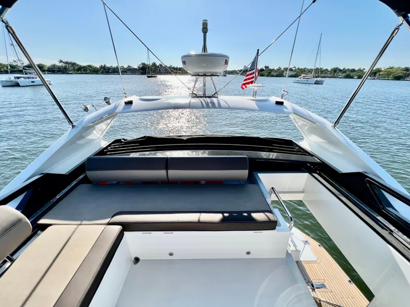 Slide: The Image of 2022 Galeon 470 Sky yacht, spacious deck with seating, on a serene water backdrop. - 14
