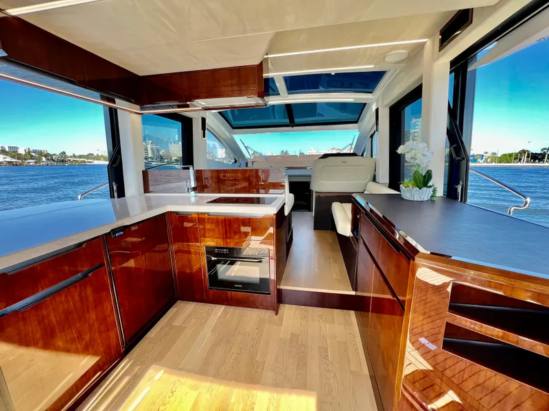 Slide: The Image of Interior of 2022 Galeon 470 Sky yacht with modern kitchen and panoramic windows. - 21