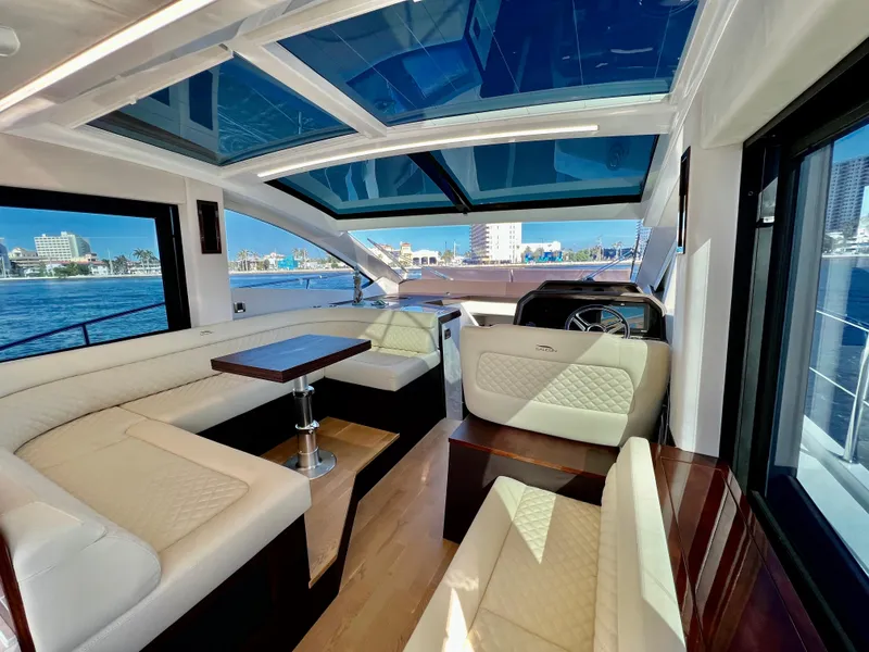 Slide: The Image of Interior of 2022 Galeon 470 Sky yacht with luxurious seating and panoramic windows. - 23