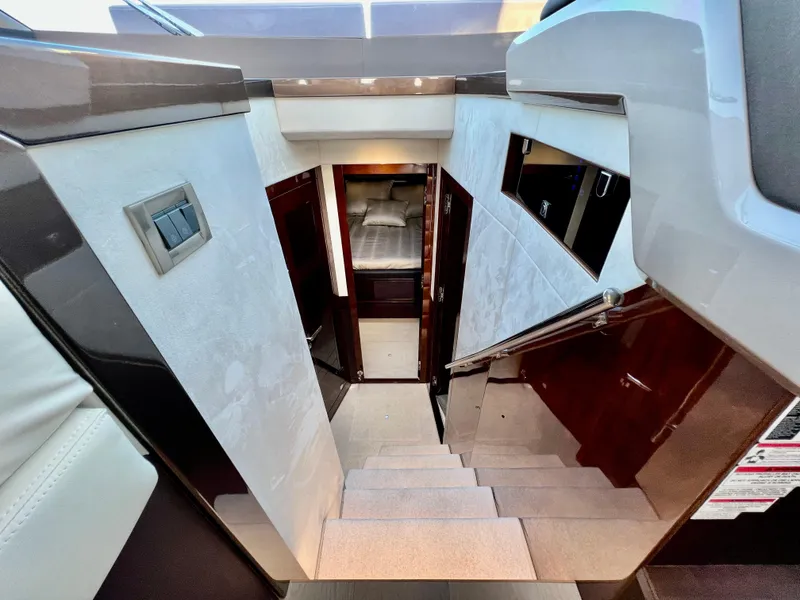Slide: The Image of Interior stairs of 2022 Galeon 470 Sky yacht leading to cabin. - 28