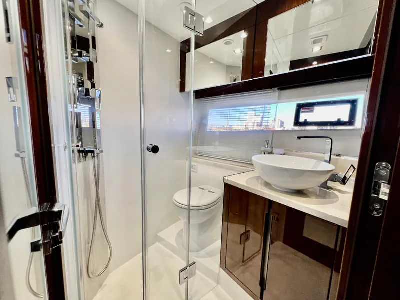 Slide: The Image of Modern bathroom on 2022 Galeon 470 Sky yacht with glass shower and vessel sink. - 30