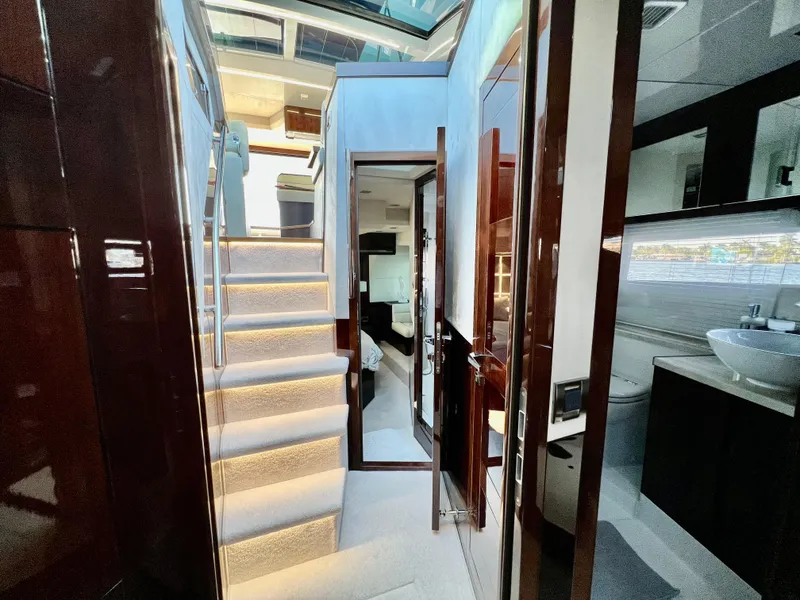 Slide: The Image of Interior of 2022 Galeon 470 Sky yacht with illuminated stairs and modern design. - 31