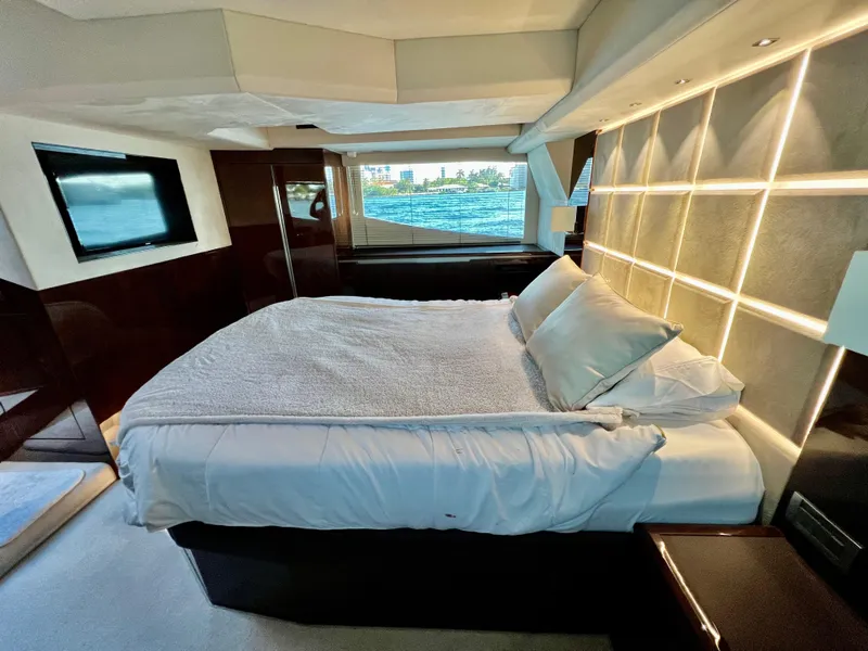 Slide: The Image of Luxurious bedroom in 2022 Galeon 470 Sky yacht with modern decor and waterfront view. - 34