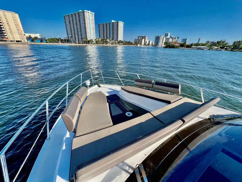 Slide: The Image of Galeon 470 Sky 2022 yacht with sun loungers, city skyline in background. - 36