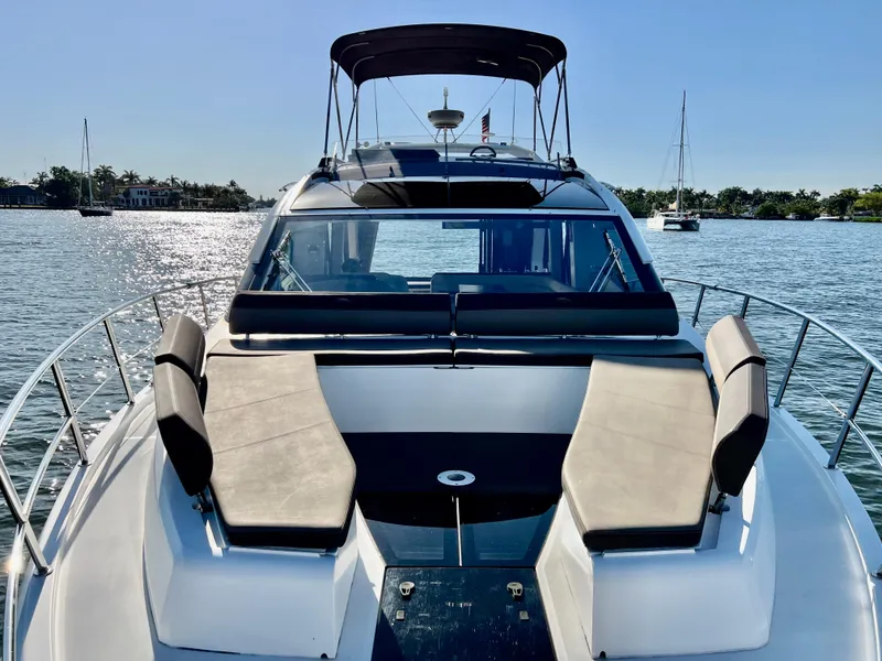 Slide: The Image of 2022 Galeon 470 Sky yacht on calm water with sunbathing area. - 37