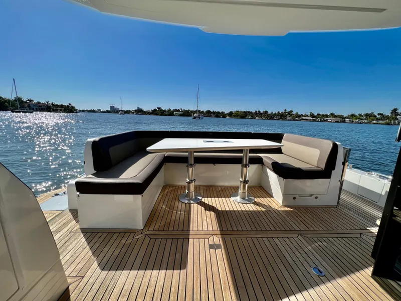 Slide: The Image of Outdoor seating area on 2022 Galeon 470 Sky yacht with scenic water view. - 5