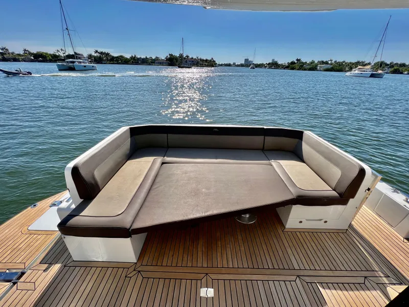 Slide: The Image of Luxury seating area on the 2022 Galeon 470 Sky yacht, overlooking serene waters. - 6