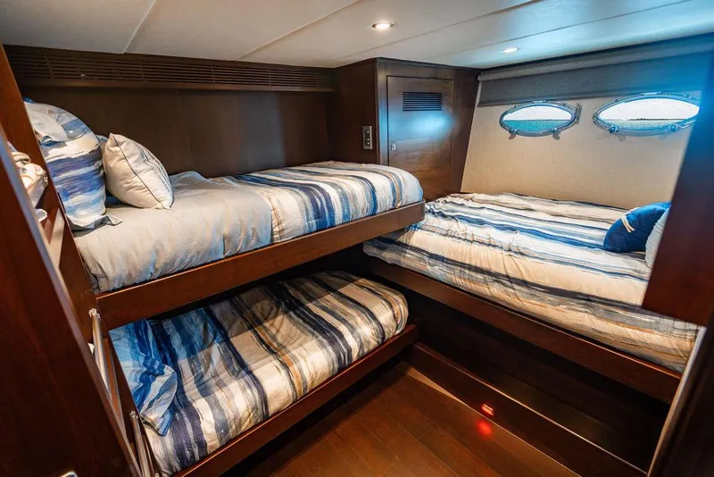 Slide: The Image of Luxurious cabin interior with wooden bunk beds and nautical-themed bedding on a 2013 Custom 73 Lanzarote. - 101