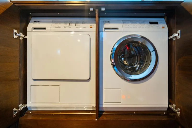 Slide: The Image of Built-in washer and dryer in wooden cabinet, Custom 73 Lanzarote 2013 model. - 106