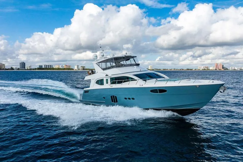 Slide: The Image of Luxury yacht "73 Lanzarote" cruising on open water, 2013 model, under a partly cloudy sky. - 13
