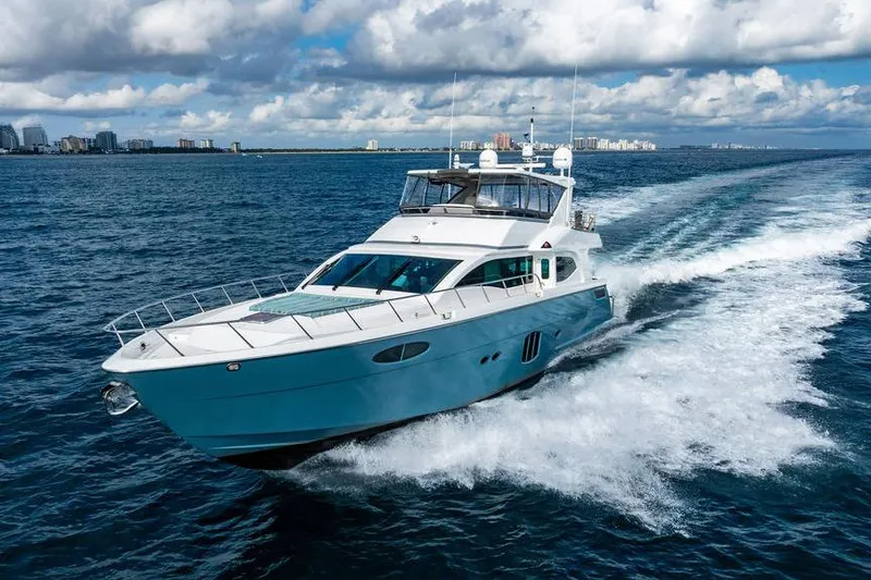 Slide: The Image of Luxurious 2013 Custom 73 Lanzarote yacht cruising on open water under a cloudy sky. - 16