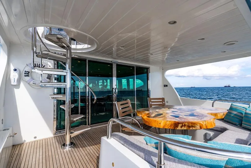Slide: The Image of Luxurious yacht deck with spiral staircase, wooden table, and ocean view, Custom 73 Lanzarote 2013. - 28