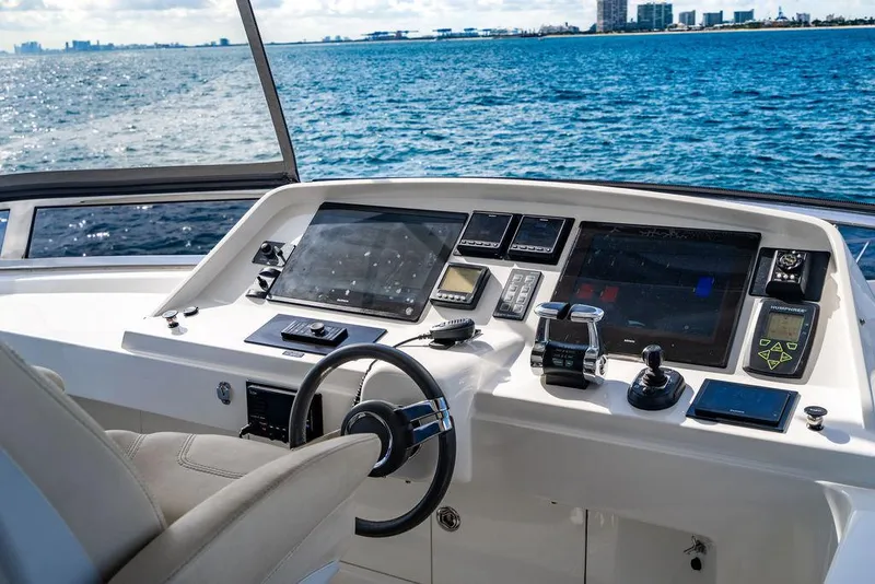 Slide: The Image of Helm of 2013 Custom 73 Lanzarote yacht with modern navigation equipment and ocean view. - 45
