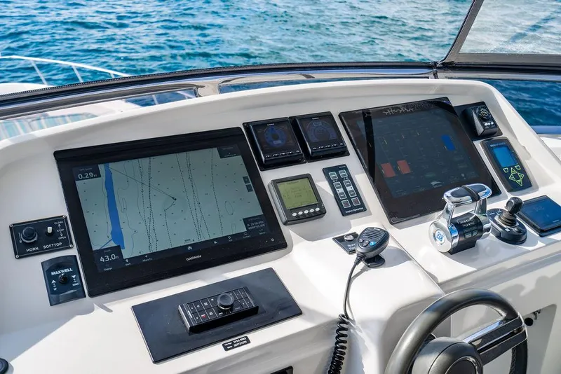 Slide: The Image of Cockpit of 2013 Custom 73 Lanzarote yacht with navigation screens and controls. - 48