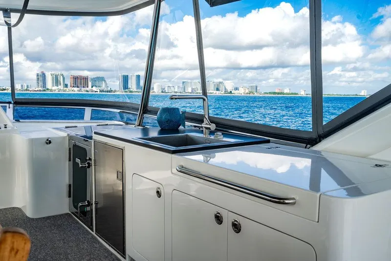 Slide: The Image of Luxurious yacht interior with ocean view, featuring sleek kitchen area, Custom 73 Lanzarote, 2013. - 53