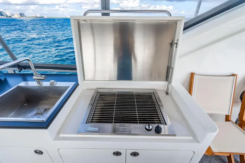 Slide: The Image of Outdoor yacht kitchen with stainless steel grill and sink, overlooking ocean view. Custom 73 Lanzarote, 2013. - 54