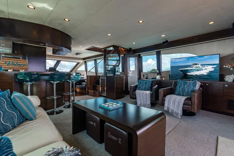 Slide: The Image of Luxurious yacht interior with modern decor, bar stools, and large TV, Custom 73 Lanzarote, 2013. - 61