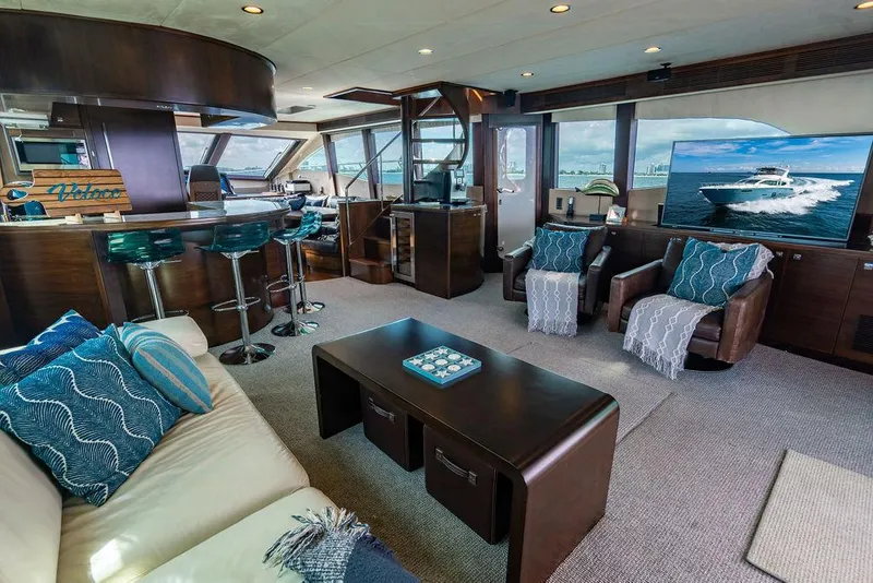 Slide: The Image of Luxurious yacht interior with modern decor, bar stools, and ocean view on TV. Custom 73 Lanzarote, 2013. - 62