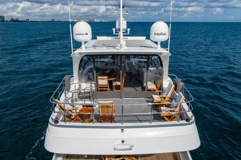 Slide: The Image of Luxury yacht "73 Lanzarote" cruising on open sea, featuring spacious deck and seating. - 7