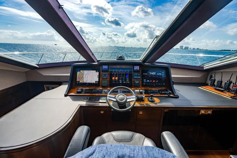 Slide: The Image of Luxurious yacht cockpit with advanced navigation systems, overlooking the ocean. Custom 73 Lanzarote, 2013. - 74