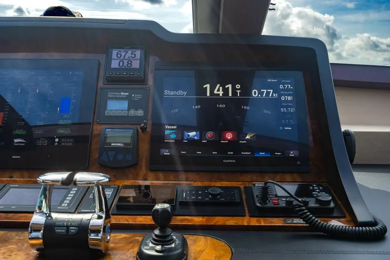 Slide: The Image of Control panel of a 2013 Custom 73 Lanzarote yacht with navigation displays. - 78