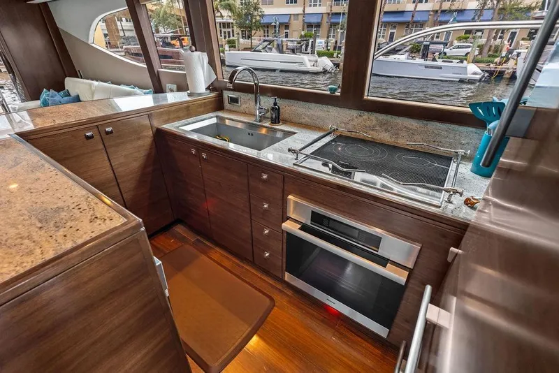 Slide: The Image of Luxurious yacht kitchen interior with modern appliances, wooden cabinetry, and large windows. Custom 73 Lanzarote, 2013. - 70