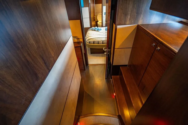 Slide: The Image of Luxurious yacht interior with wooden finishes, hallway leading to a cozy bedroom. Custom 73 Lanzarote, 2013. - 83