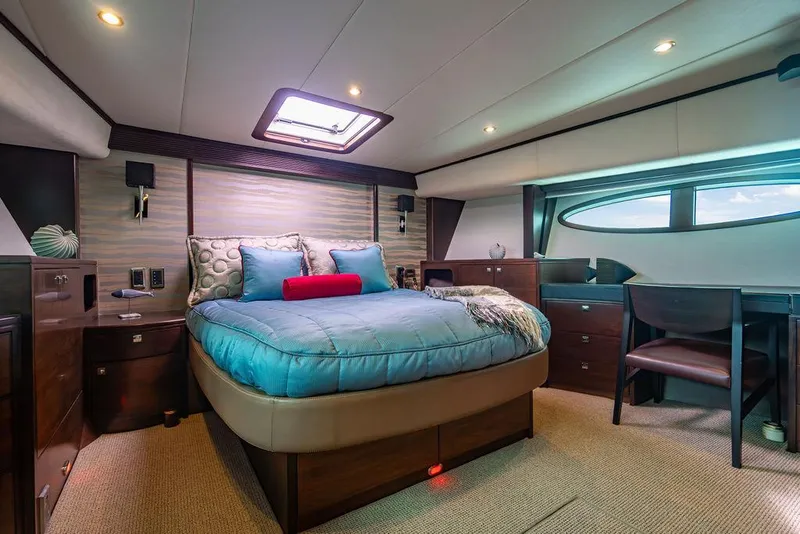 Slide: The Image of Luxurious yacht bedroom interior with modern decor, featuring a comfortable bed and elegant furnishings. - 85