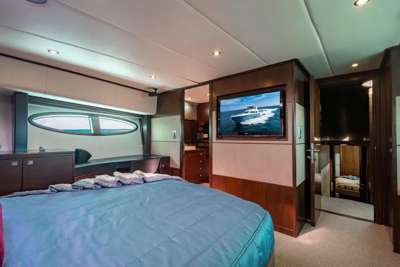 Slide: The Image of Luxurious yacht bedroom interior with modern design, featuring a large bed and wall-mounted TV. - 86