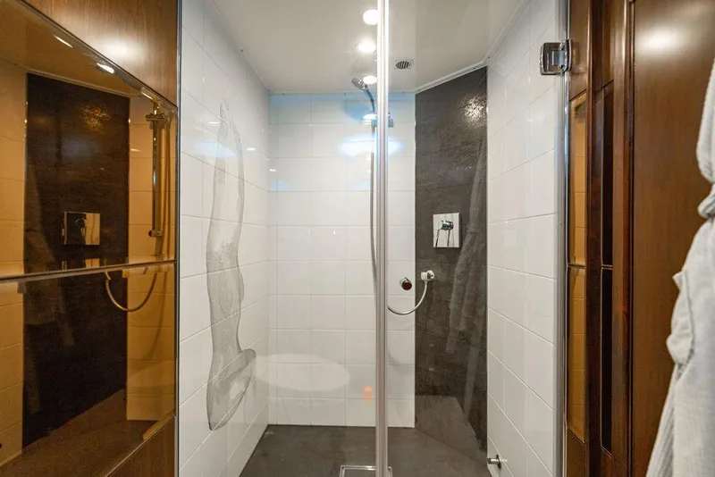 Slide: The Image of Modern shower with glass door, white tiles, and dark accent wall in Custom 73 Lanzarote, 2013. - 90