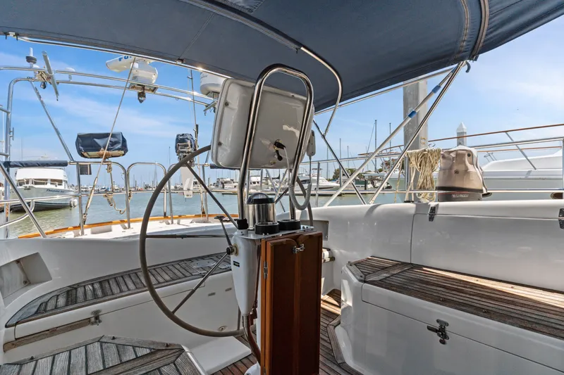 Slide: The Image of Cockpit view of 2009 Pasport 51 yacht docked at marina with clear blue sky. - 10