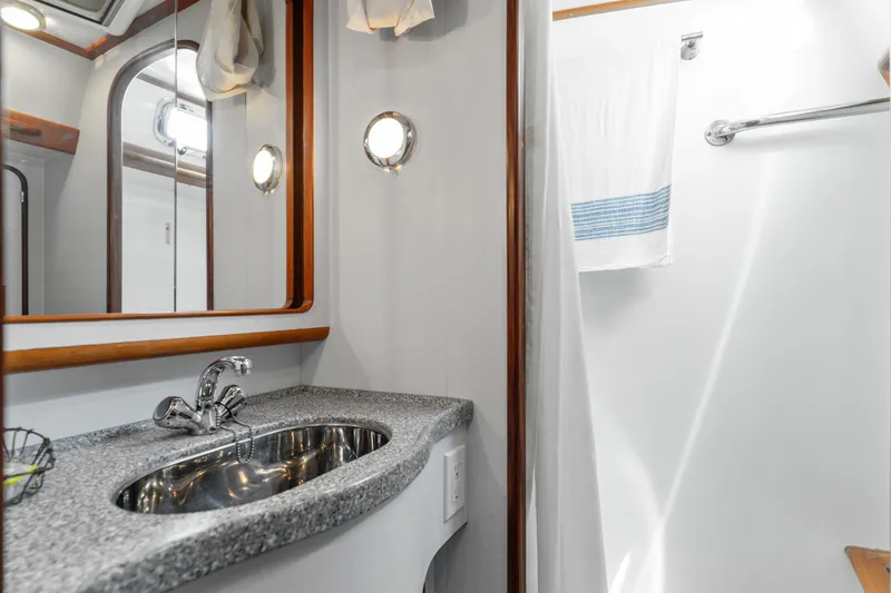 Slide: The Image of Luxurious bathroom in 2009 Pasport 51 yacht with modern sink and elegant fixtures. - 25