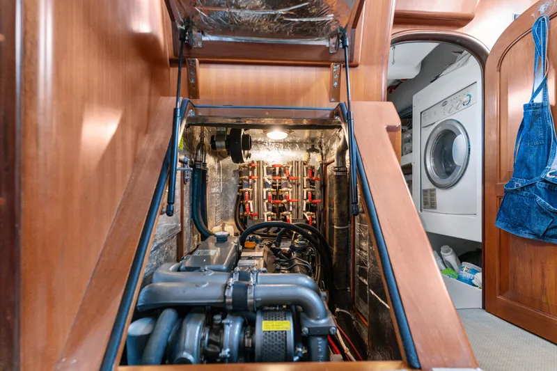 Slide: The Image of Engine room of a 2009 Pasport 51 yacht with visible laundry area. - 38