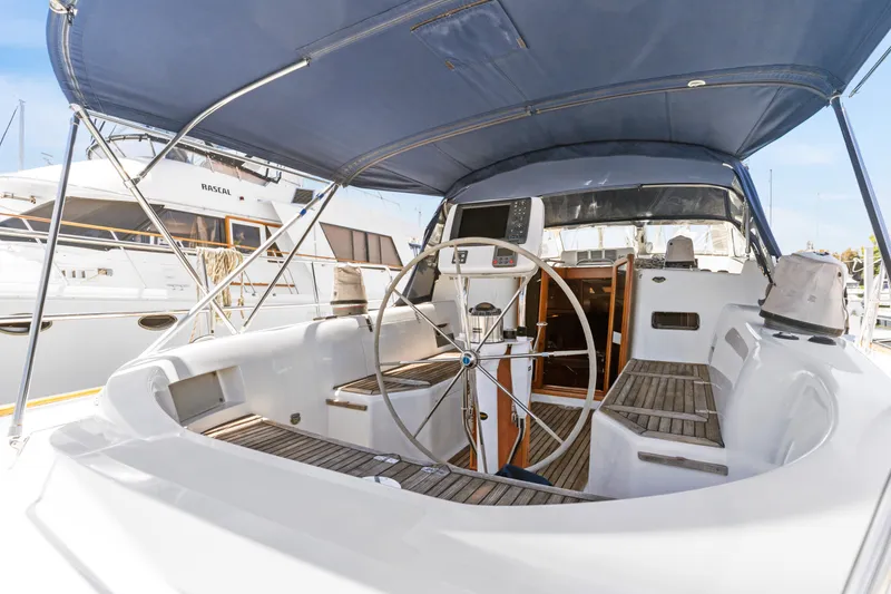 Slide: The Image of Cockpit of 2009 Pasport 51 yacht with steering wheel and navigation equipment. - 6