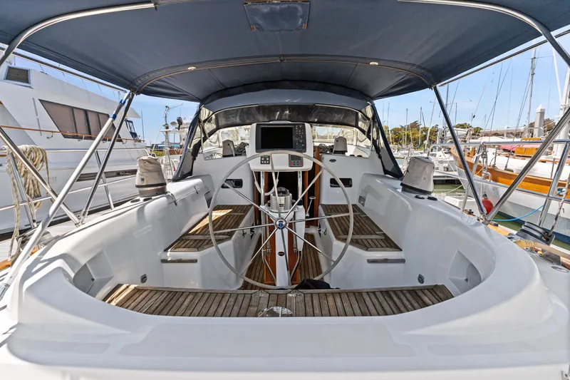 Slide: The Image of Cockpit of a 2009 Pasport 51 sailboat with steering wheel and navigation equipment. - 7