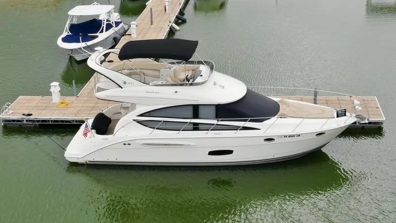 Slide: The Image of 2013 Meridian 391 Sedan docked on calm water. - 4