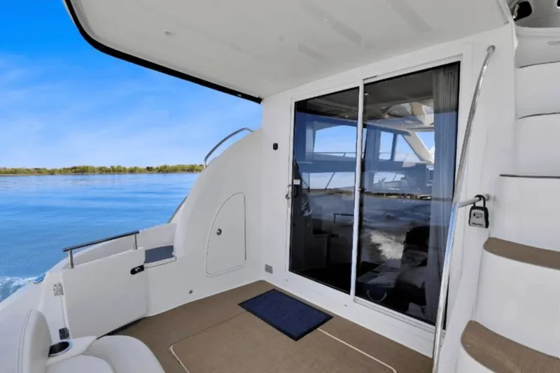 Slide: The Image of 2013 Meridian 391 Sedan on calm waters with modern interior. - 45