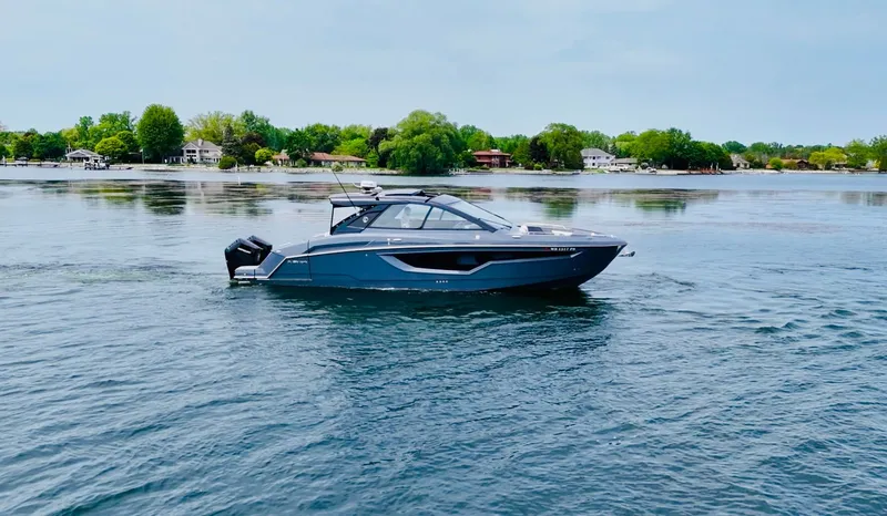 Slide: The Image of 2023 Cruisers Yachts 42 GLS on calm water. - 13
