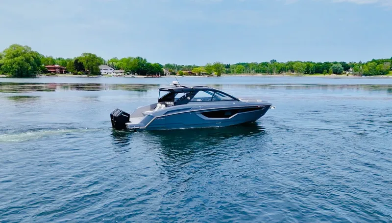 Slide: The Image of 2023 Cruisers Yachts 42 GLS on calm water. - 14