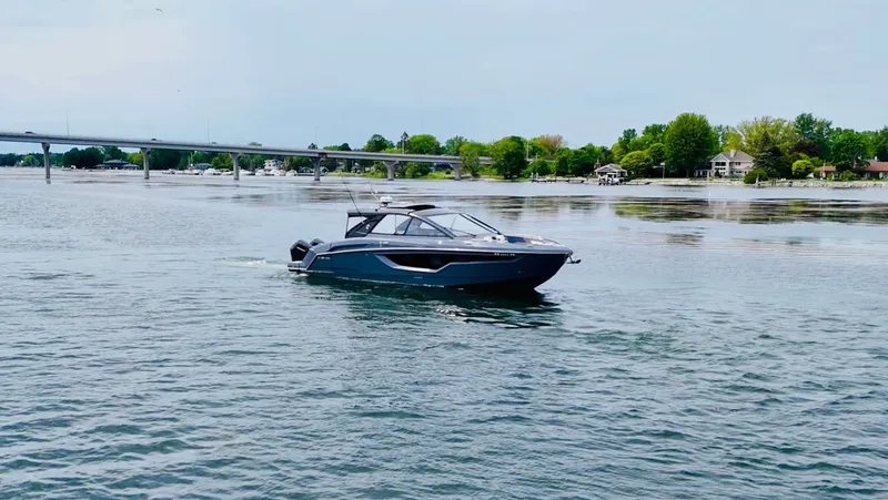 Slide: The Image of 2023 Cruisers Yachts 42 GLS on calm water. - 16